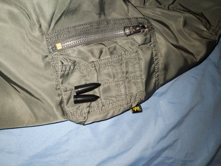 Alpha Industries MA-1 silver jacket.