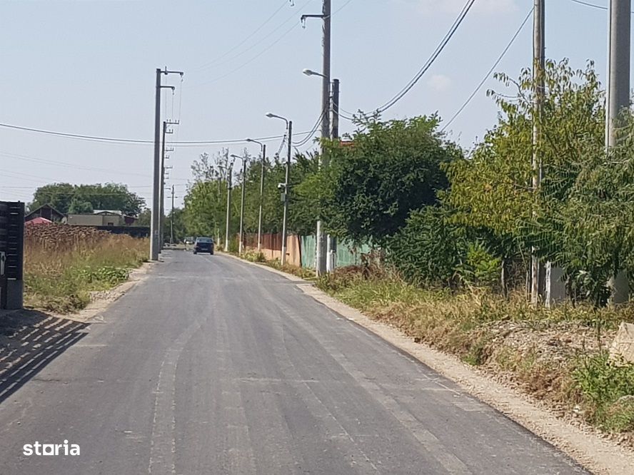 Vanzare teren langa padure,drum amenajat,case noi ,620 mp,26500 E