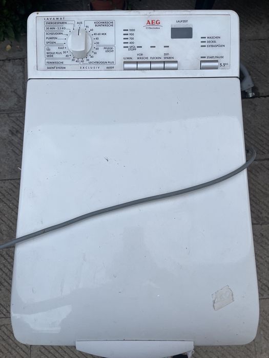 Пералня с горно зареждане AEG