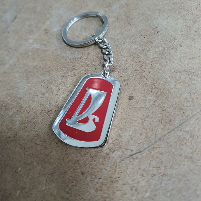 Брелоки в виде эмблем продам