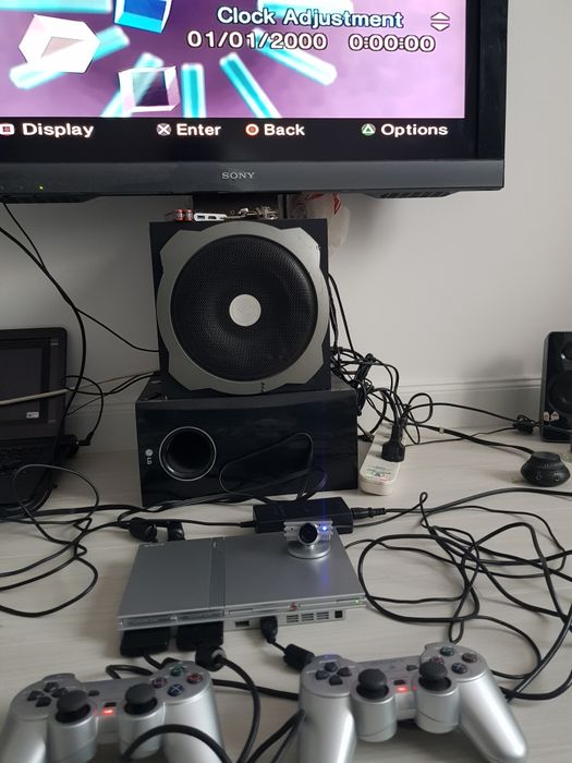PlayStation 2 Slim Silver - 2 manete originale + Cameră EyeToy set complet