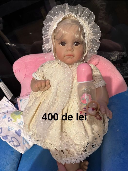 Papusa Reborn bebelus realist cu corp silicon textil marsupiu carut