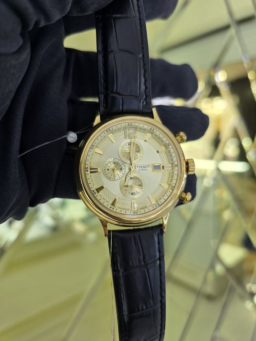 Продам золотые часы Tissot 750 пробы