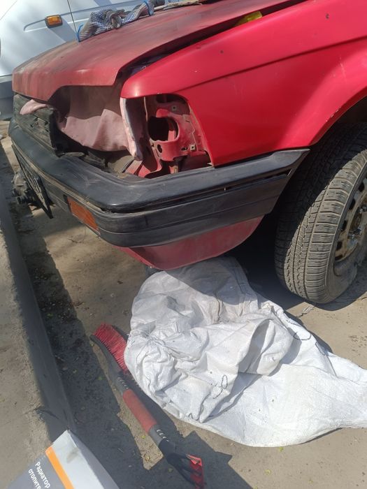 Передний бампер Mazda 323 BF