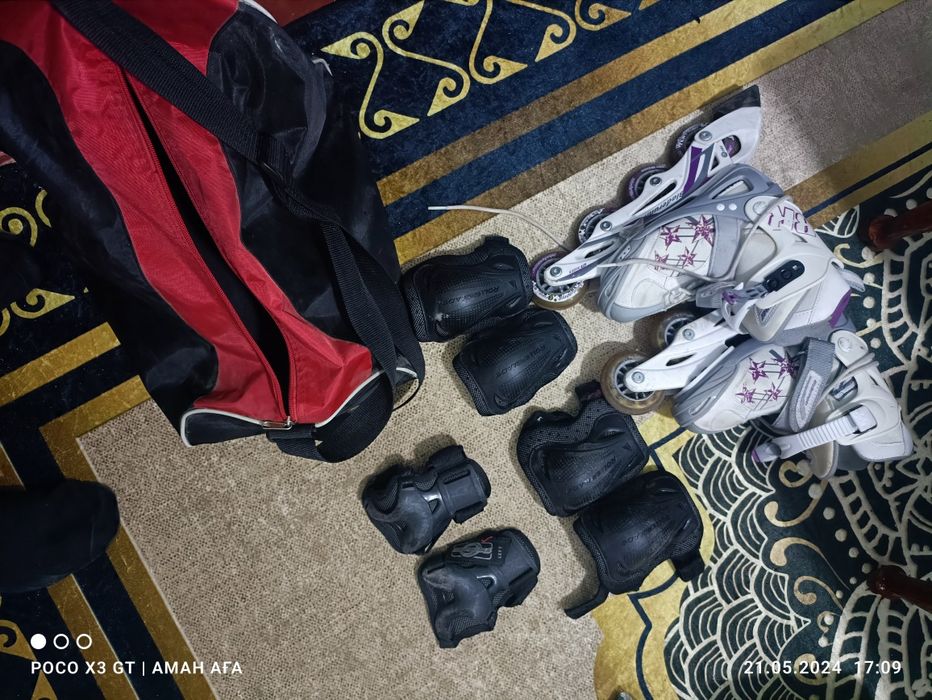 Роликовые коньки