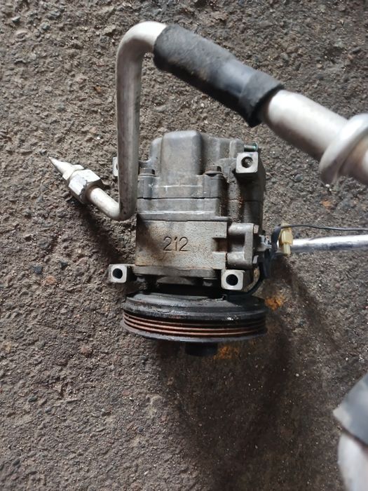 Компрессор кондиционера Мазда 323