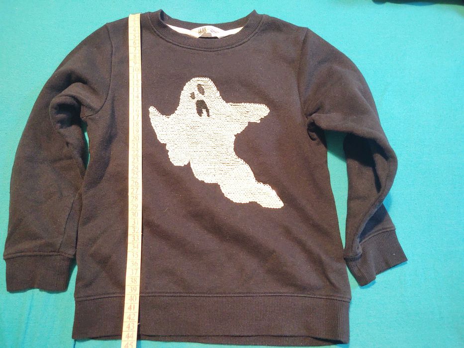 Блуза НМ с обръщащи се и светещи в тъмното пайети