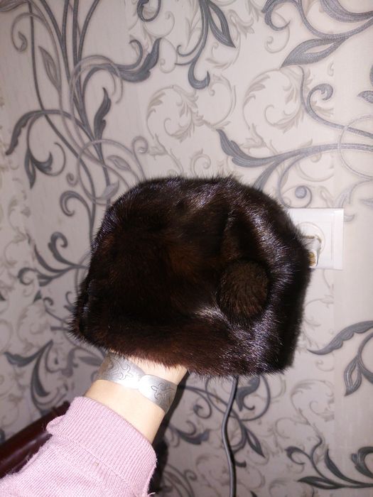 новыи норкавая шапка не одевала