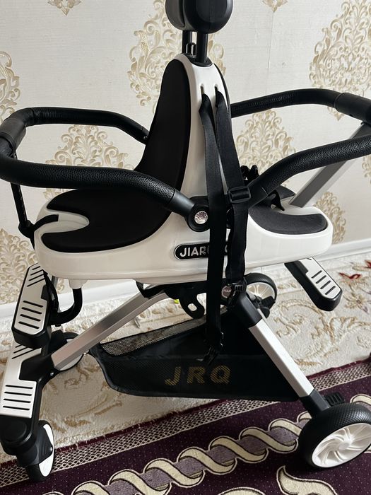 Екі балаға арналған коляска