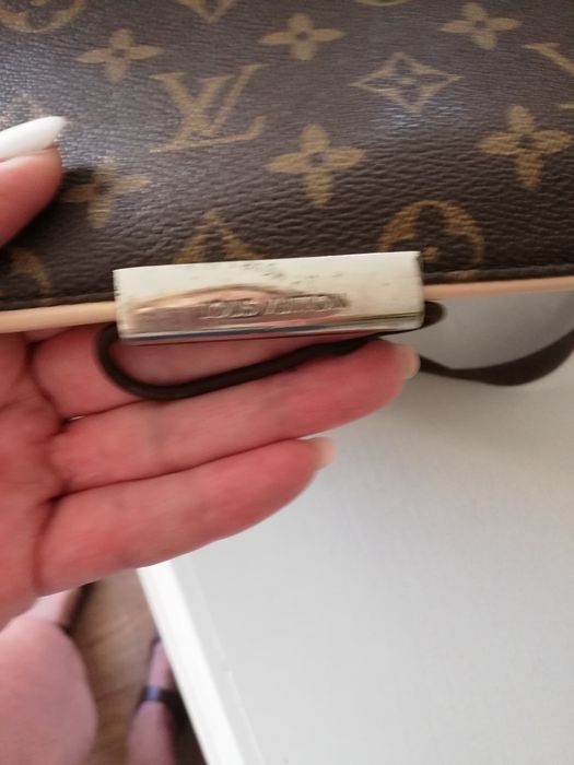 Geantă LOUIS VUITTON, model poștaș pentru LEPTOP.