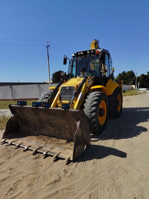 New Holland 115 Pagruzchik