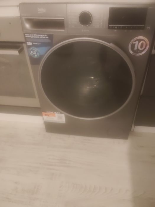 Mașina de spălat haine cu uscător  beko
