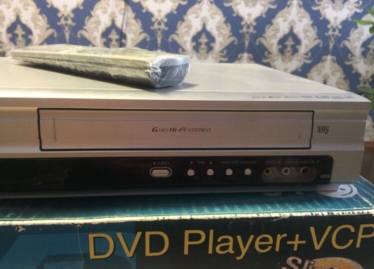 LG (2 в 1) DVD плеер + видеокассета