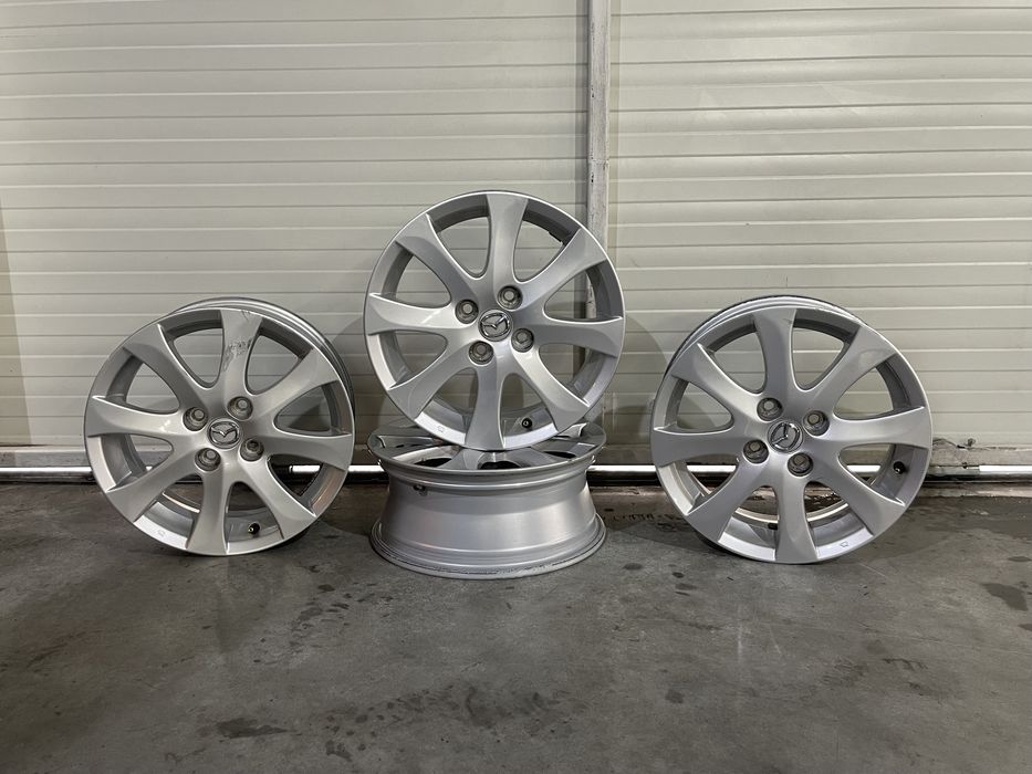 Set 4 jante aliaj 15  4x100 Originale Mazada Demio
