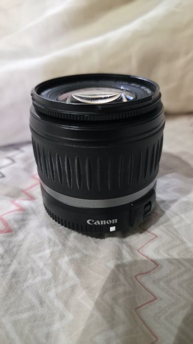 Объектив Canon вспышка Nikon