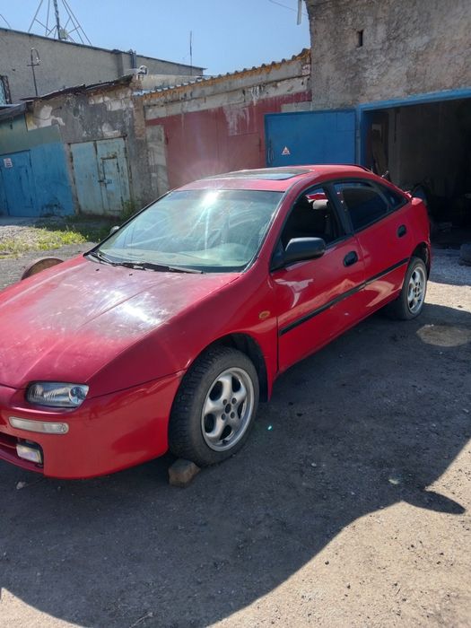 Продам Mazda 323 после ДТП, на ходу.