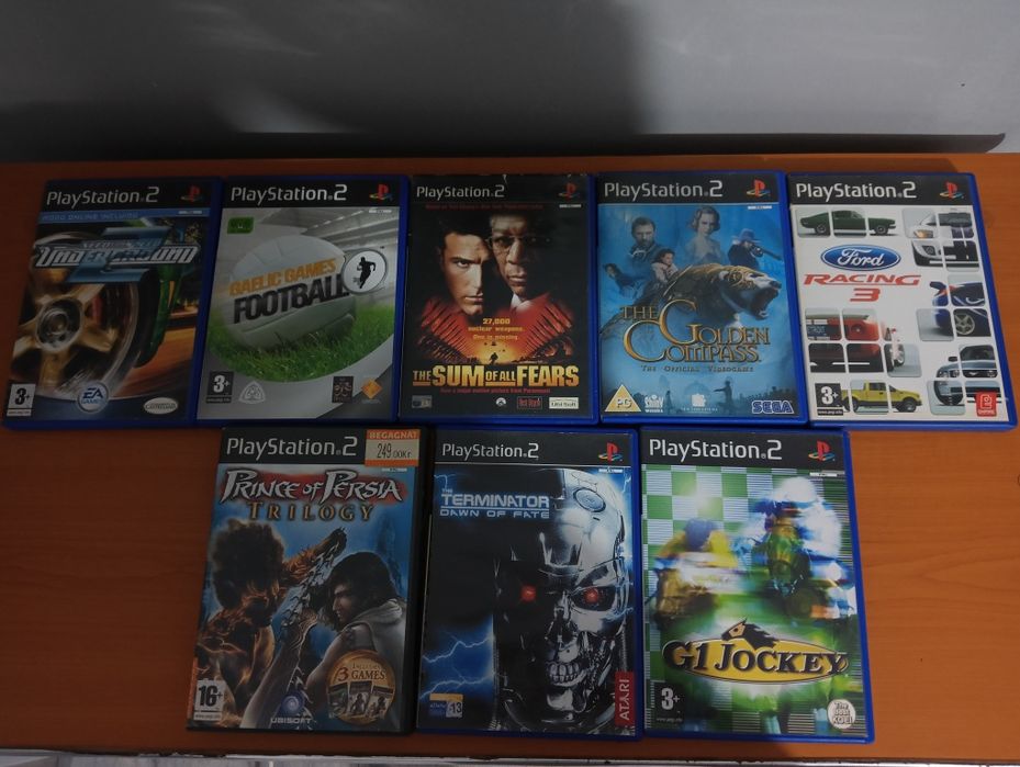PlayStation 2 Slim + 8 jocuri + manetă
