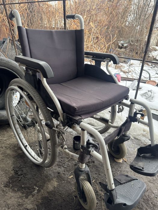Инвалидная коляска.