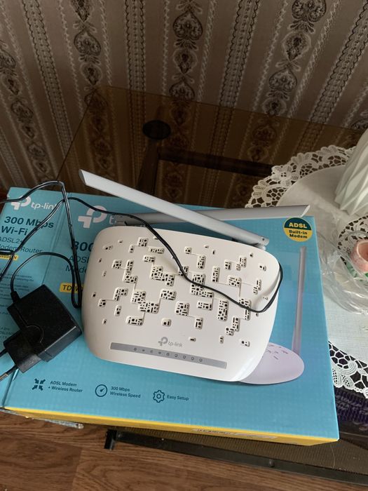Новый модем роутер и многофункциональный стационарный телефон б/у в по