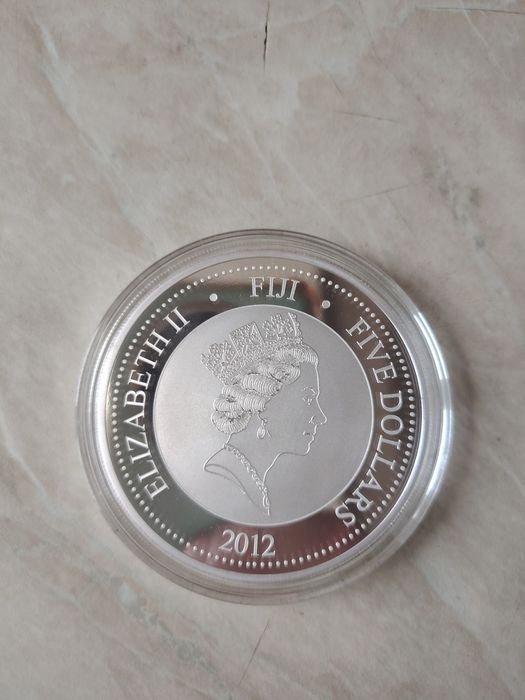 Инвестиционни монети сребърна монета с частично позлатяване 24 карата