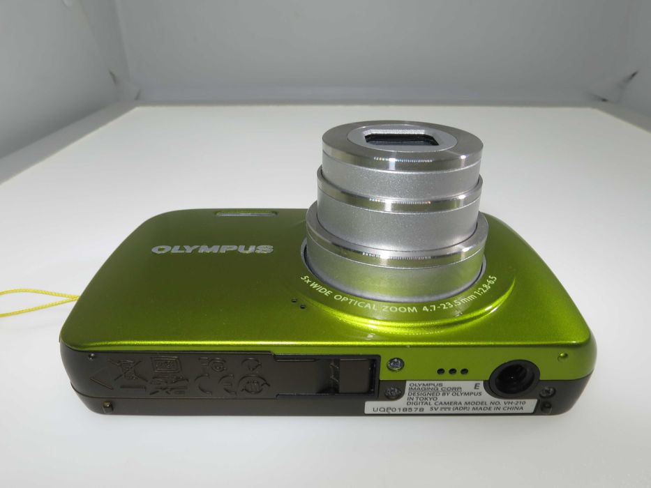 Olympus VH 210 ултра компактен фотоапарат в страхотен свеж зелен цвят и състояние като НОВО, тестван и работи отлично, пълен комплект