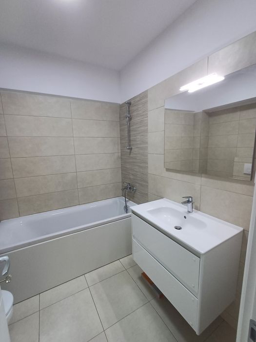 Ofer spre închiriere apartament 2 camere ,loc de parcare Conest Ozana