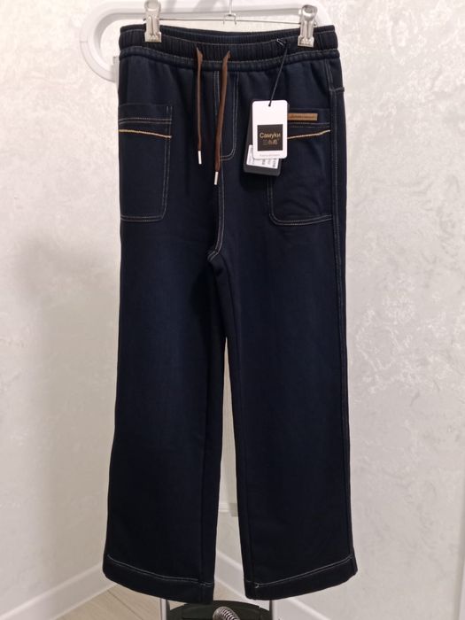 Продам новые джинсовые утипленные брюки