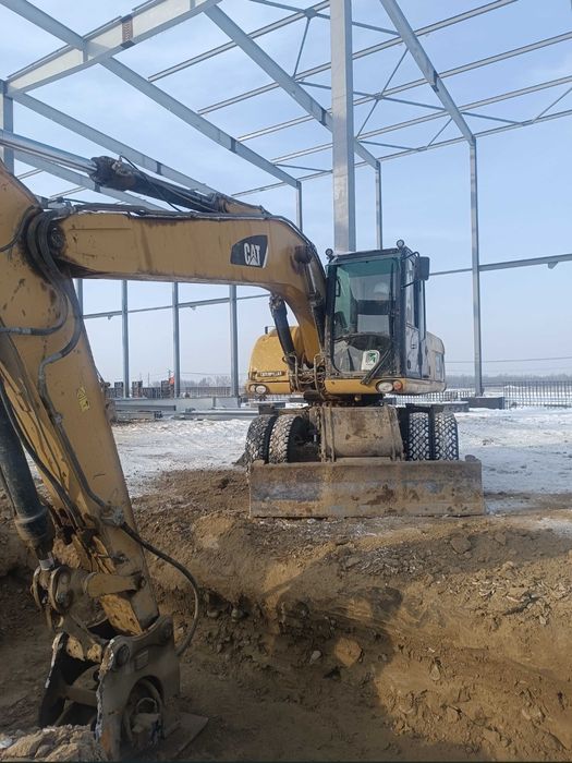 Продам колёсный экскаватор Caterpillar M318D