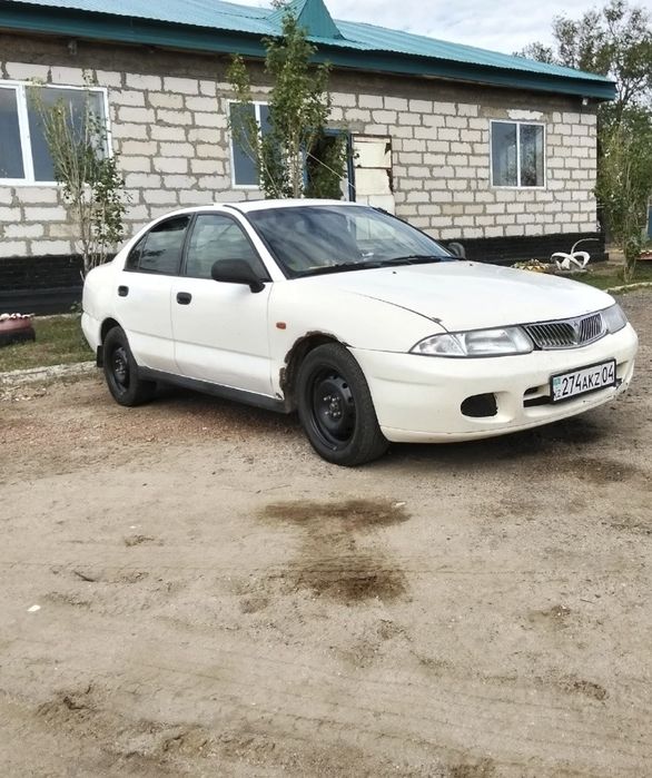 Митсубиси каризма 1999год