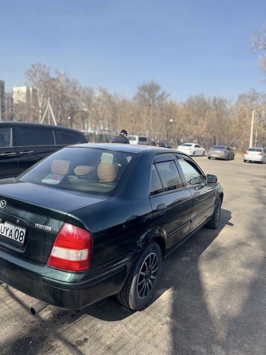 Мазда 323  кандёрмен