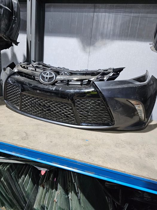 Передний бампер Камри