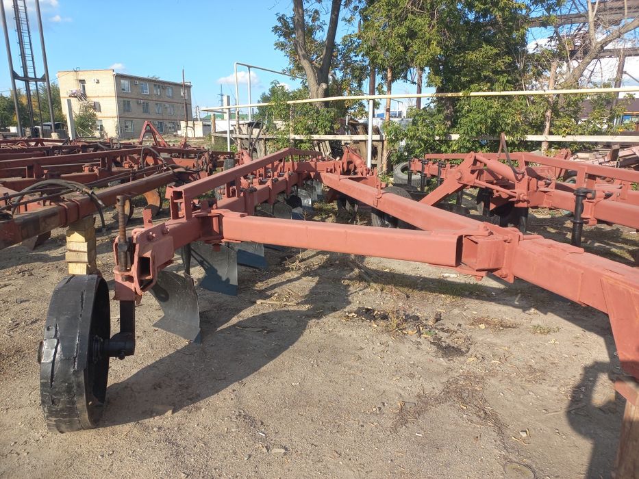 Плуг 9корпусный прицепной