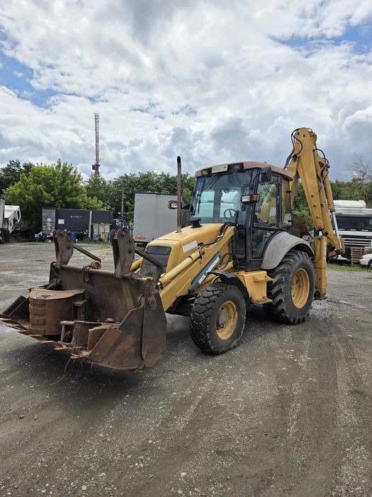 Buldoexcavator New Holland NH 95