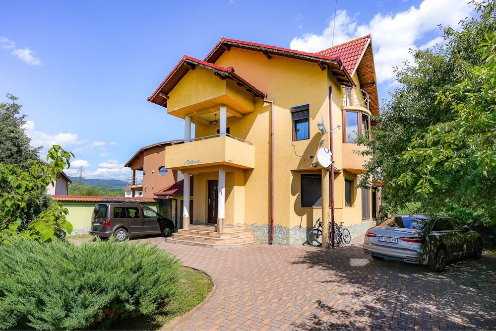 Casă de vânzare – 110 mp, curte spațioasă și grădină verde