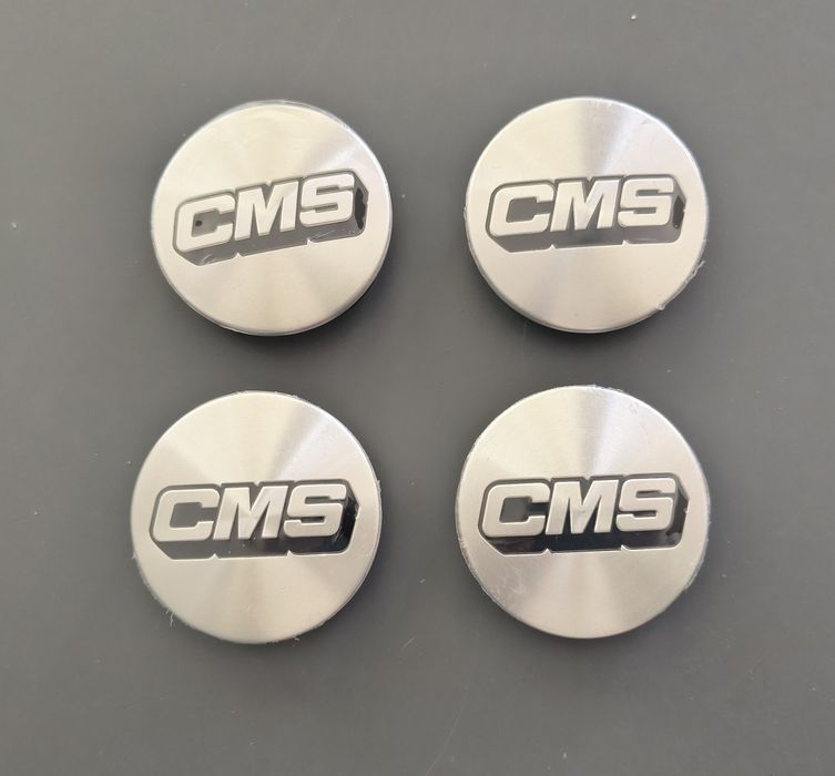 Capace jante CMS - 60 mm 
diametru 60 mm la emblema 
Originale CMS Made in Germany