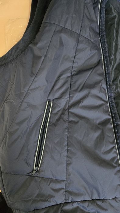 Продам фирменную жилетку