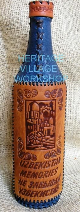 Бутылки сувенирные декорированные кожей.