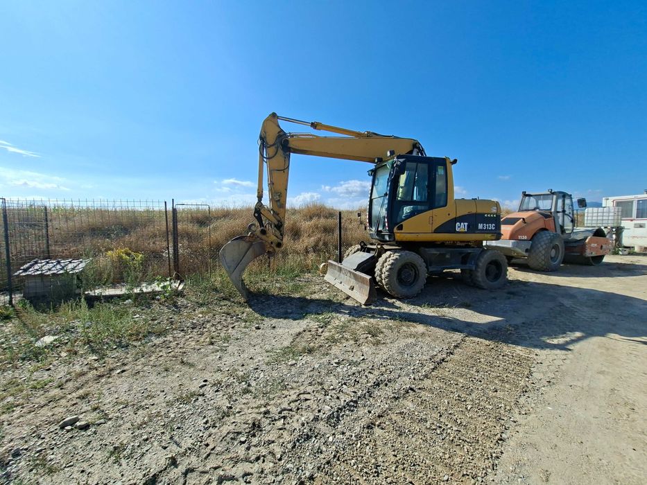 Excavator pe roti CAT 313M