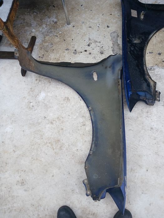 Крыло Мазда 323 седан 1996г в оригинале