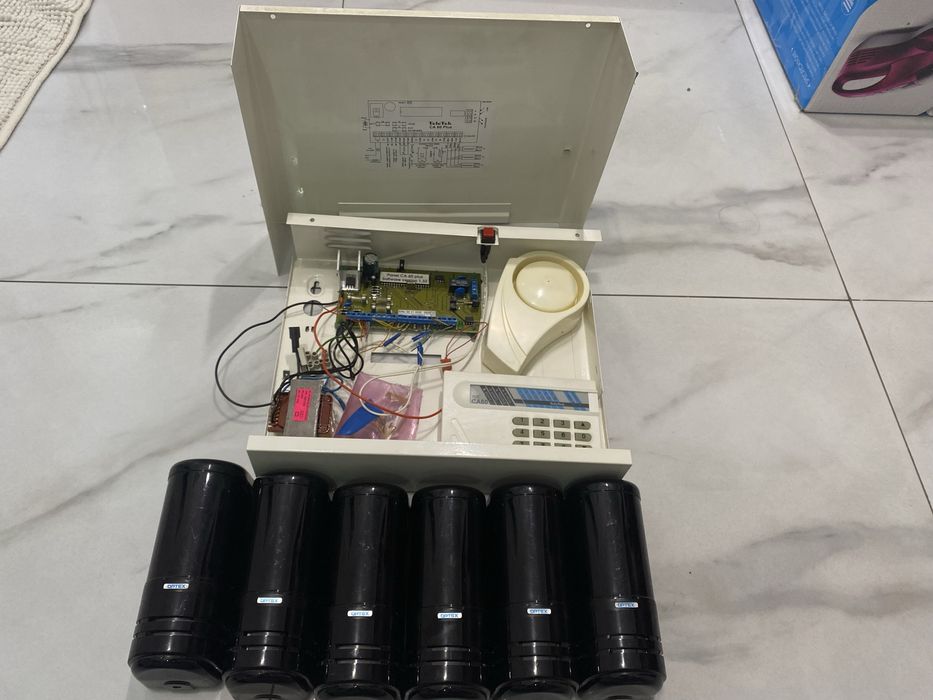 OPTEX – външни периметрови бариери + TeleTek СОТ централа