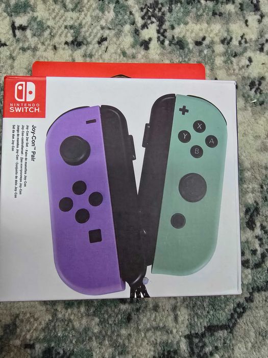 set de controlere Nintendo Switch Joy-Con în nuanțele pastel violet și verde