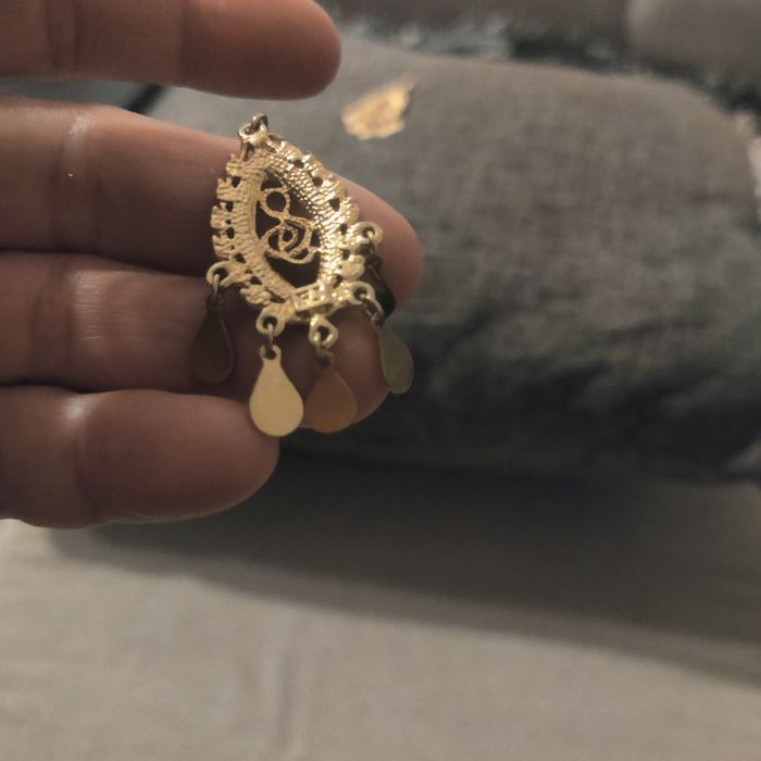 Лого на нота със камъчета