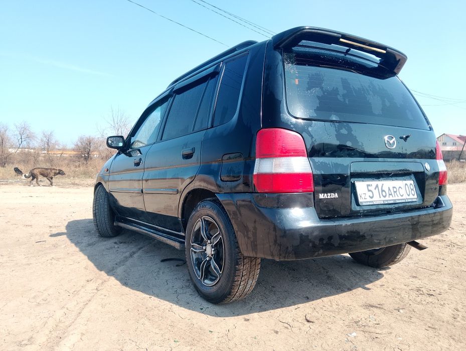Мазда демио 2003 года