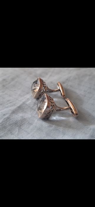 Серебряные запонки.