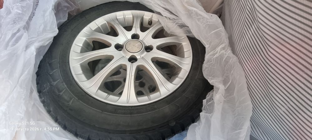 Продам комплект(4шт)  зимних колёс  Nordman R14 на титанах