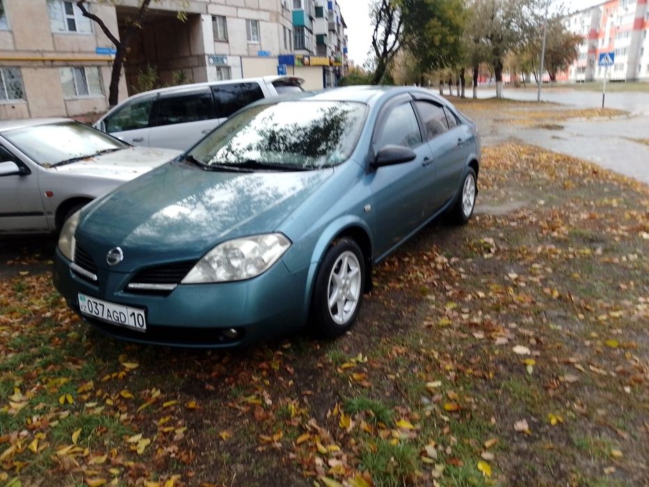 Ниссан п12 2002 год