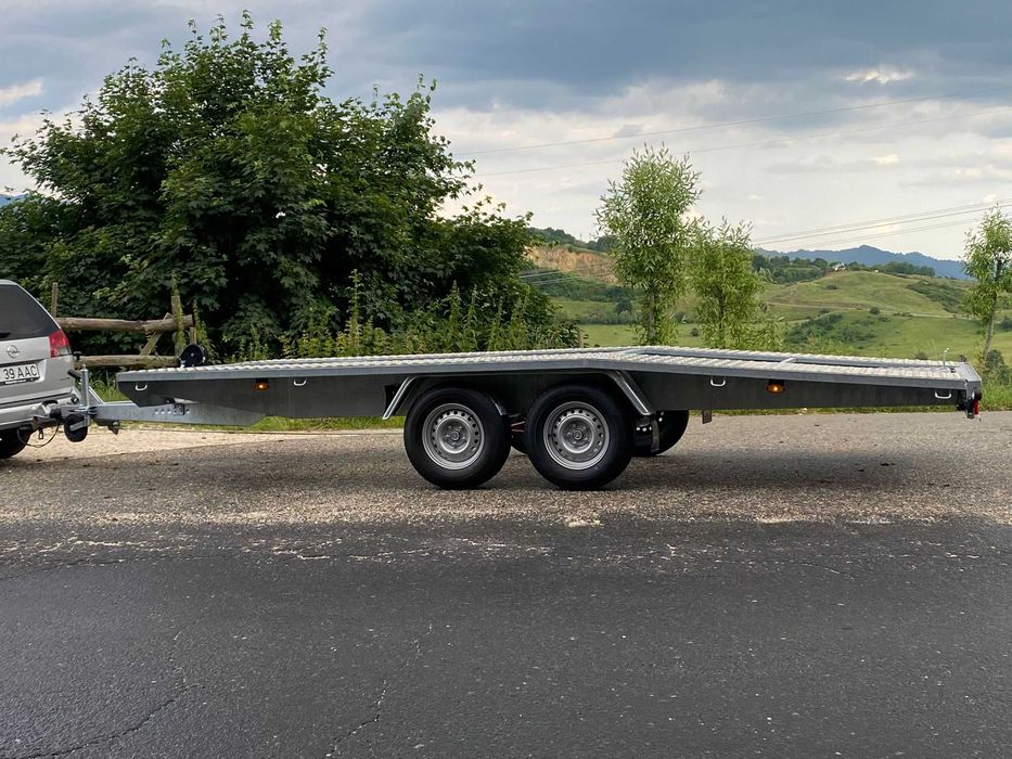 Transport auto pe platforma, tractare