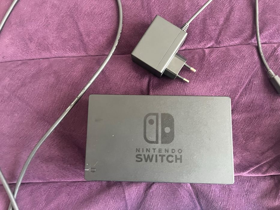 Nintendo switch + 13 jocuri + volan si accesorii