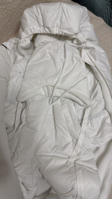 Продам новый комбинезон с конвертом