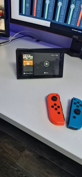 Nintendo Switch cu accesorii multe + 4 jocuri